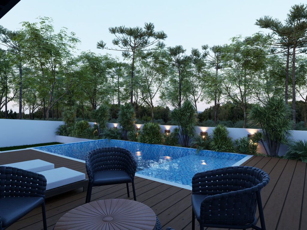 Casa Ninho Verde — área da piscina ao entardecer